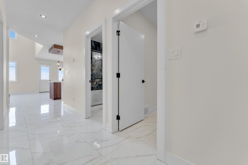 Corridor featuring recessed lighting and light marble finish floors - 231 Crystal Creek Drive, Leduc, AB - Indoor Photo Showing Other Room