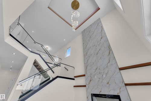 Detailed view of suspended lighting - 231 Crystal Creek Drive, Leduc, AB - Indoor Photo Showing Other Room