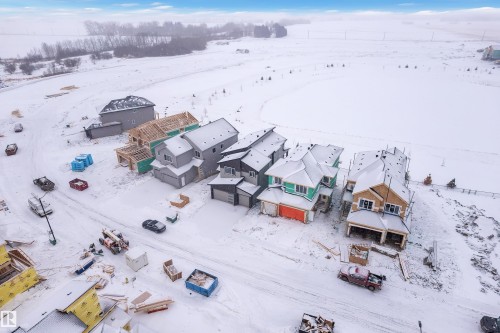 Snowy aerial view with a residential view - 231 Crystal Creek Drive, Leduc, AB - Outdoor With View
