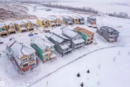 Snowy aerial view with a residential view - 231 Crystal Creek Drive, Leduc, AB - Outdoor With View