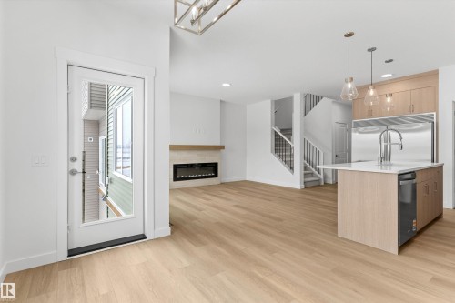 2244 4 Avenue, Edmonton, AB - Indoor Photo Showing Kitchen With Fireplace With Upgraded Kitchen