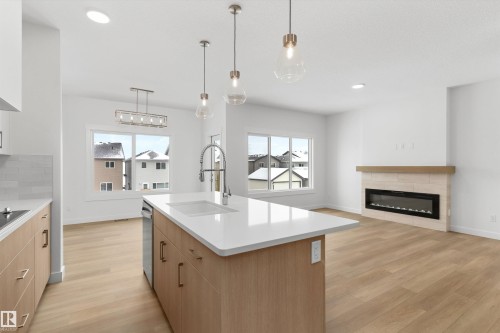 2244 4 Avenue, Edmonton, AB - Indoor Photo Showing Kitchen With Fireplace