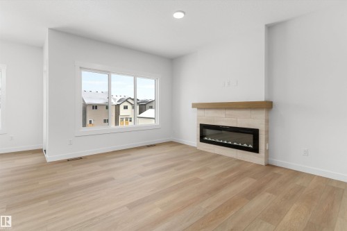 2244 4 Avenue, Edmonton, AB - Indoor Photo Showing Living Room With Fireplace