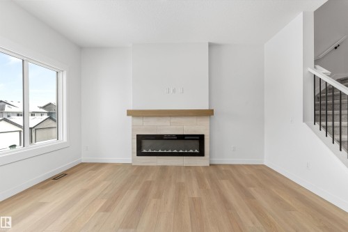 2244 4 Avenue, Edmonton, AB - Indoor Photo Showing Living Room With Fireplace