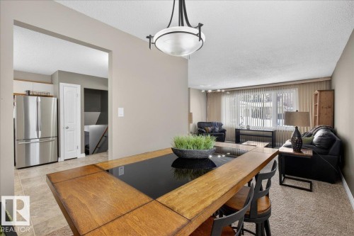 Dining room featuring a textured ceiling - 8804 38 Avenue, Edmonton, AB - Indoor