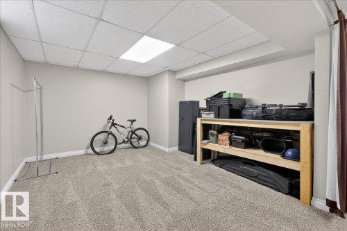 Misc room featuring a paneled ceiling and light carpet - 8804 38 Avenue, Edmonton, AB - Indoor