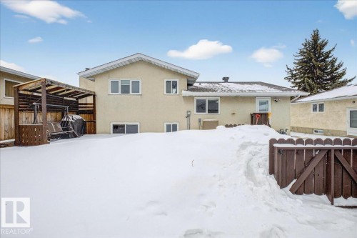 Snow covered house featuring stucco siding - 8804 38 Avenue, Edmonton, AB - Outdoor
