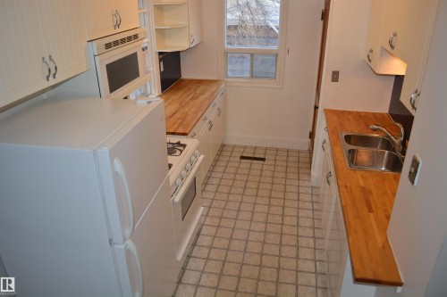 7727 112S Avenue, Edmonton, AB - Indoor Photo Showing Kitchen With Double Sink