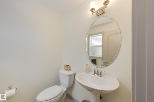 Half bath featuring toilet - 17528 58 Street, Edmonton, AB - Indoor Photo Showing Bathroom