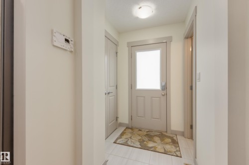 Doorway to outside featuring tile patterned flooring - 17528 58 Street, Edmonton, AB - Indoor Photo Showing Other Room