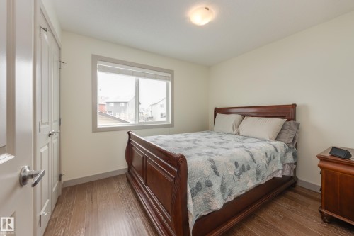 Bedroom featuring hardwood / wood-style flooring - 17528 58 Street, Edmonton, AB - Indoor Photo Showing Bedroom