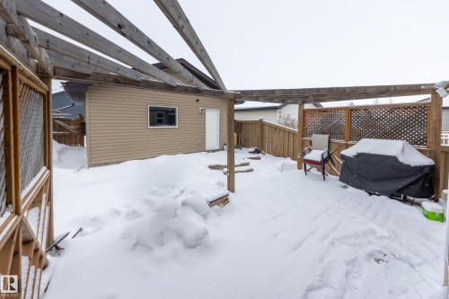 Fenced backyard with area for grilling and a pergola - 17528 58 Street, Edmonton, AB - Outdoor With Exterior