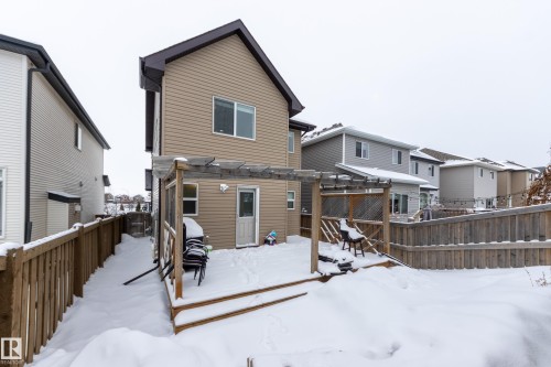 Rear view of property with a wooden deck, a fenced backyard, and a pergola - 17528 58 Street, Edmonton, AB - Outdoor With Exterior