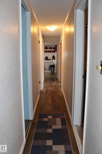 leading from the back of the mobile to the front. - 56 4204 47St., Wetaskiwin, AB - Indoor Photo Showing Other Room