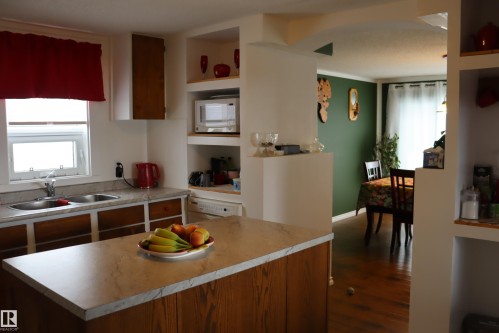 Large island - 56 4204 47St., Wetaskiwin, AB - Indoor Photo Showing Kitchen With Double Sink