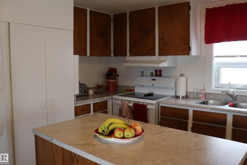 New update doors - 56 4204 47St., Wetaskiwin, AB - Indoor Photo Showing Kitchen With Double Sink