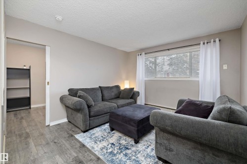 4 8803 101 Street, Edmonton, AB - Indoor Photo Showing Living Room