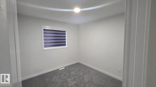 Mainfloor 338 Munn Way, Leduc, AB - Indoor Photo Showing Other Room