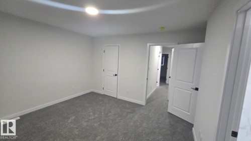 Mainfloor 338 Munn Way, Leduc, AB - Indoor Photo Showing Other Room