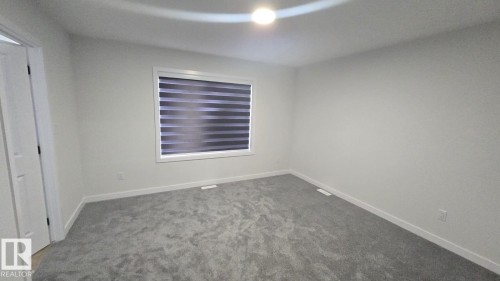 Mainfloor 338 Munn Way, Leduc, AB - Indoor Photo Showing Other Room