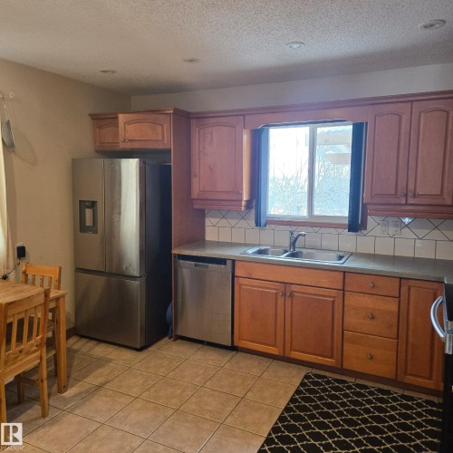 3105 130A Avenue, Edmonton, AB - Indoor Photo Showing Kitchen With Double Sink