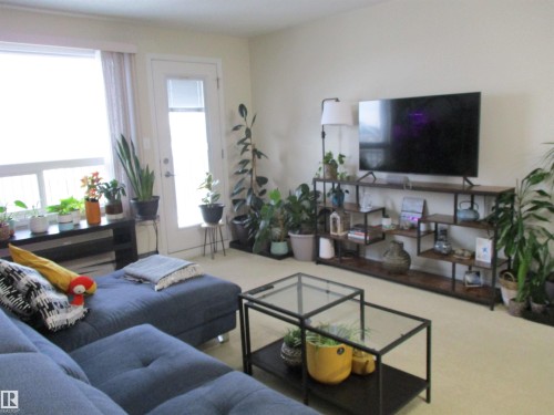 View of carpeted living area - 3309 9351 Simpson Drive, Edmonton, AB - Indoor Photo Showing Living Room