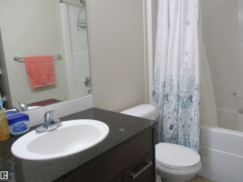 Full bath with vanity and shower / bath combination with curtain - 3309 9351 Simpson Drive, Edmonton, AB - Indoor Photo Showing Bathroom