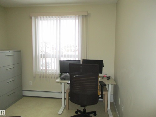 Office featuring baseboards and a baseboard radiator - 3309 9351 Simpson Drive, Edmonton, AB - Indoor Photo Showing Office