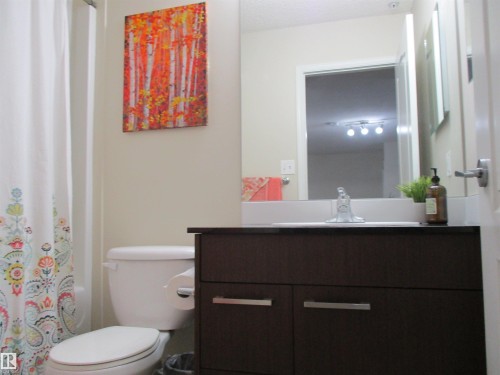 Full bathroom with vanity and shower / bathtub combination with curtain - 3309 9351 Simpson Drive, Edmonton, AB - Indoor Photo Showing Bathroom