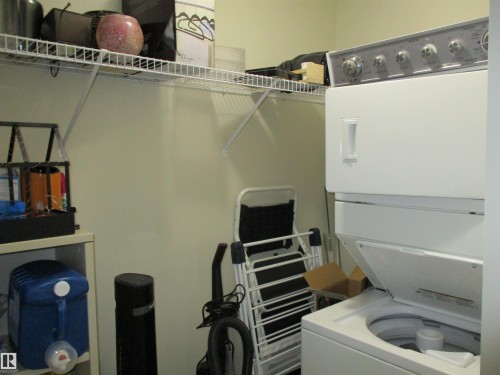 Laundry area featuring stacked washer / dryer - 3309 9351 Simpson Drive, Edmonton, AB - Indoor Photo Showing Laundry Room
