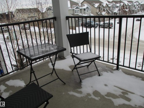 Snow covered back of property featuring a residential view - 3309 9351 Simpson Drive, Edmonton, AB - Outdoor With Exterior