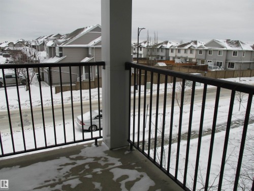 Snow covered back of property with a residential view - 3309 9351 Simpson Drive, Edmonton, AB - Outdoor