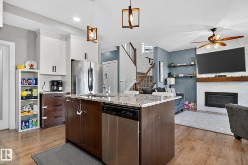 775 Berg Loop, Leduc, AB - Indoor Photo Showing Kitchen With Fireplace
