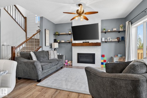 775 Berg Loop, Leduc, AB - Indoor Photo Showing Living Room With Fireplace