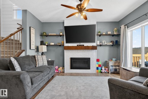 775 Berg Loop, Leduc, AB - Indoor Photo Showing Living Room With Fireplace