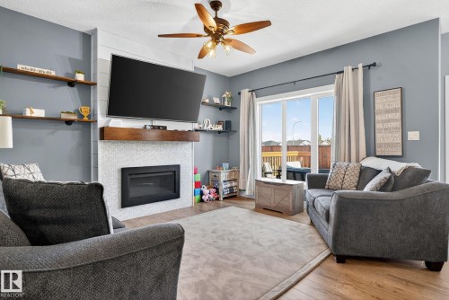 775 Berg Loop, Leduc, AB - Indoor Photo Showing Living Room With Fireplace