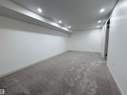 Finished basement with carpet flooring and recessed lighting - 9034 60 Street, Edmonton, AB - Indoor Photo Showing Other Room