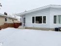View of snow covered back of property - 9034 60 Street, Edmonton, AB  - Outdoor With Exterior 