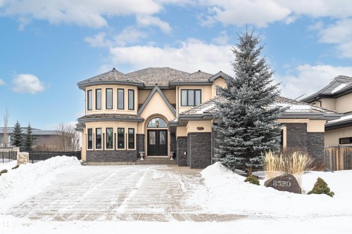 View of front of property with stucco siding and stone siding - 3520 Watson Point(E), Edmonton, AB - Outdoor With Facade