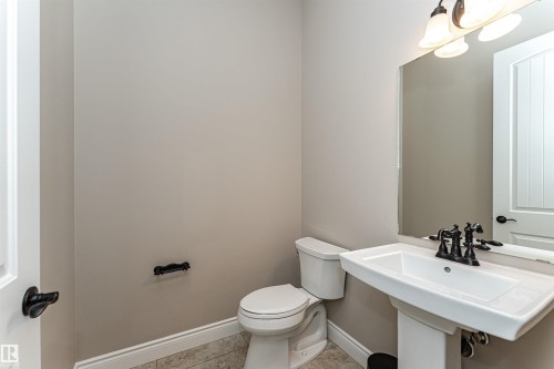 Bathroom featuring toilet and light tile patterned floors - 3520 Watson Point(E), Edmonton, AB - Indoor Photo Showing Bathroom