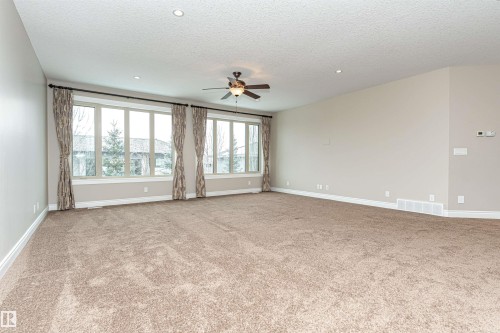 Carpeted empty room with a ceiling fan, a textured ceiling, and recessed lighting - 3520 Watson Point(E), Edmonton, AB - Indoor Photo Showing Other Room