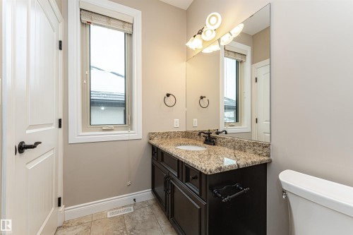 Half bath with vanity and light tile patterned floors - 3520 Watson Point(E), Edmonton, AB - Indoor Photo Showing Bathroom