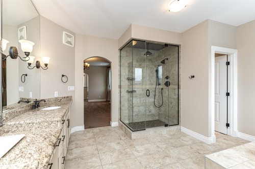 Full bath with double vanity, a stall shower, and light tile patterned floors - 3520 Watson Point(E), Edmonton, AB - Indoor Photo Showing Bathroom