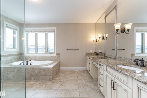 Full bath with double vanity, a garden tub, and healthy amount of natural light - 3520 Watson Point(E), Edmonton, AB - Indoor Photo Showing Bathroom