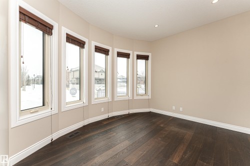 Empty room with dark wood finished floors and recessed lighting - 3520 Watson Point(E), Edmonton, AB - Indoor Photo Showing Other Room