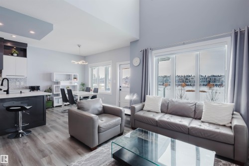 Living room with light wood-type flooring and recessed lighting - 16217 32 Avenue, Edmonton, AB - Indoor Photo Showing Living Room