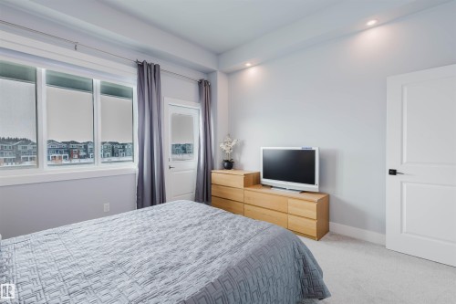 Bedroom featuring light carpet and recessed lighting - 16217 32 Avenue, Edmonton, AB - Indoor Photo Showing Bedroom