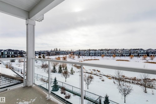 Snow covered back of property featuring a residential view - 16217 32 Avenue, Edmonton, AB - Outdoor With Balcony With View