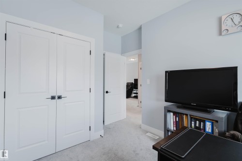 Bedroom with light colored carpet and a closet - 16217 32 Avenue, Edmonton, AB - Indoor Photo Showing Other Room