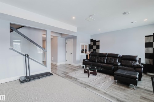 Living area with recessed lighting and light wood-style flooring - 16217 32 Avenue, Edmonton, AB - Indoor Photo Showing Other Room